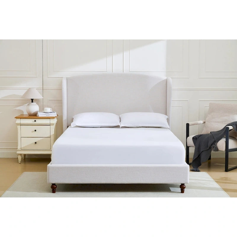 Letto a piattaforma imbottito con testiera ad ali e gambe in noce