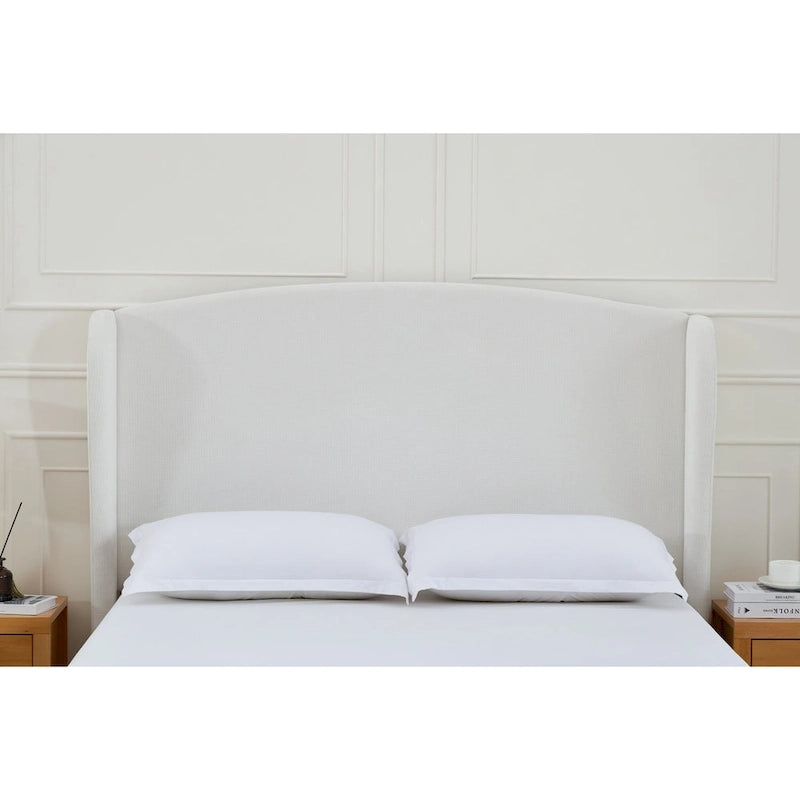 Letto a piattaforma imbottito con testiera ad ali e gambe in noce