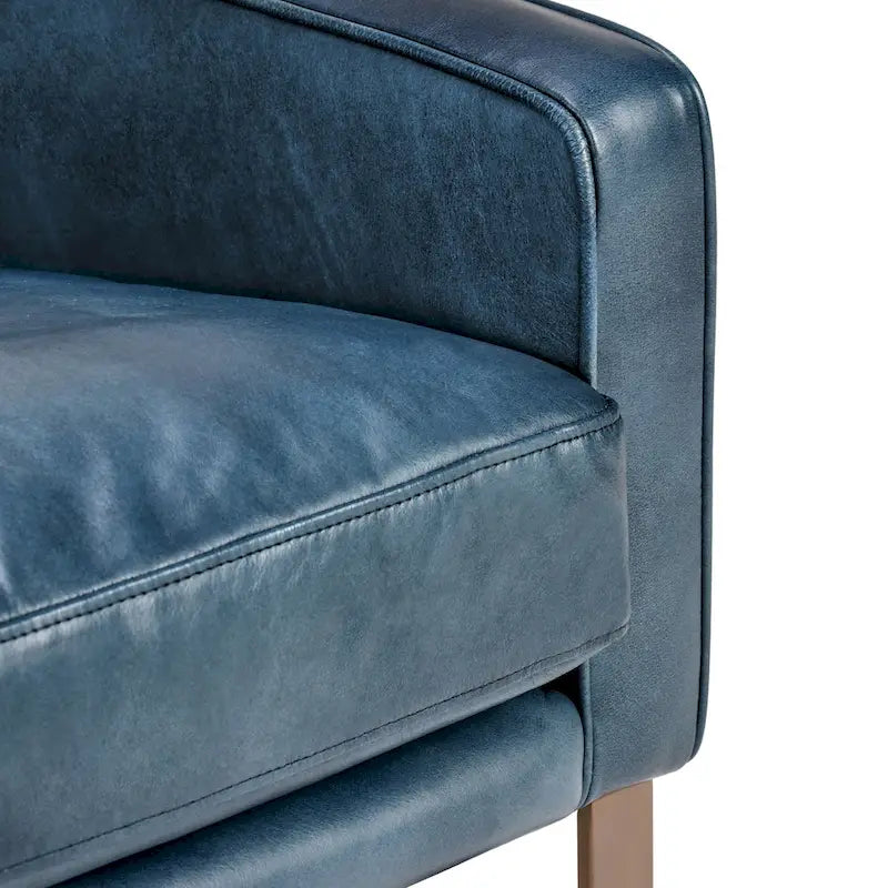 Poltrona Club in pelle blu con struttura in ottone 22W x 21D x 18.5H
