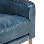 Poltrona Club in pelle blu con struttura in ottone 22W x 21D x 18.5H